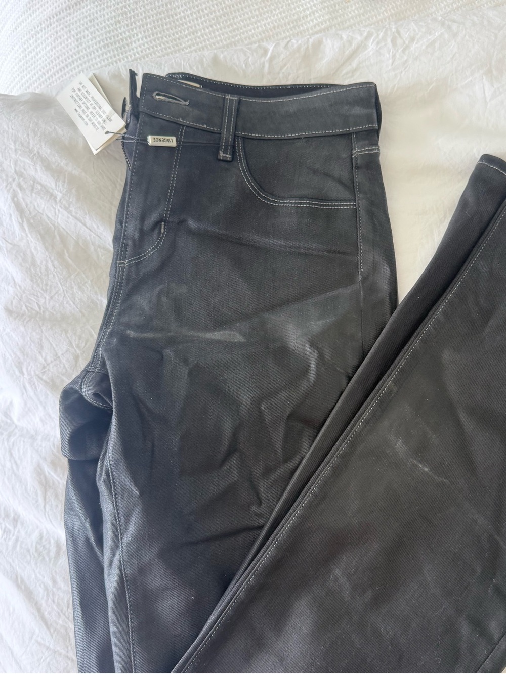 L’agence coated black pants with white stitching
